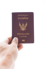 Thailand Passport and hand on white background
