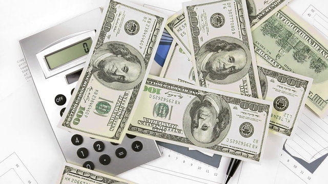 Businessman throws dollar  banknotes on the chart calculator and pen.