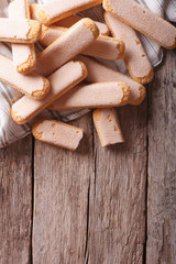 Savoiardi pastry closeup on a table. vertical top view
