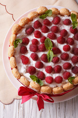 raspberry cake with mascarpone and Savoiardi closeup. vertical top view
