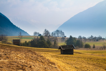 Naklejka premium Rural mountain landscape with a hut