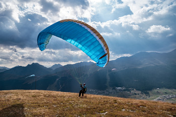 Paraglider on an alpine plateau