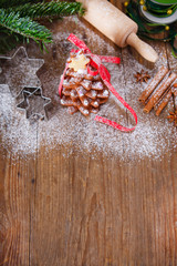 Homemade baked Christmas gingerbread tree on vintage wooden back
