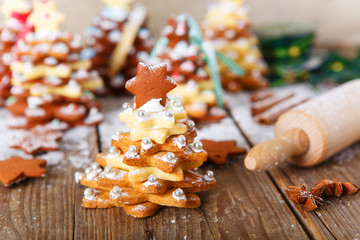 Homemade baked Christmas gingerbread tree on vintage wooden back