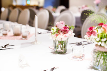 Table set in pink and white for wedding or event party.