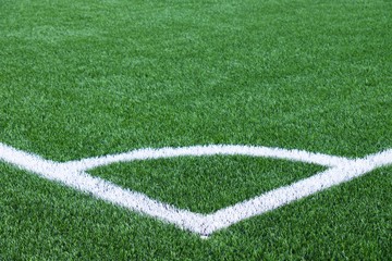 Naklejka premium White line corner on green football field