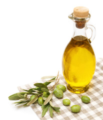 Olive oil and olive branch isolated on white