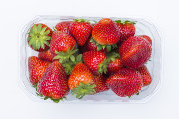 Fresh strawberries, with petioles, on white background.