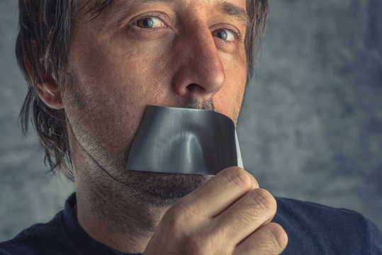 Fighting Censorship, Man Removing Duct Tape From Mouth