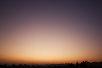 Sky gradient from blue to orange sunset