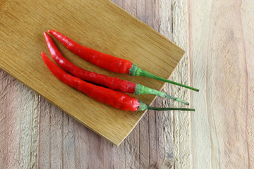 Red peppers in bamboo dish.