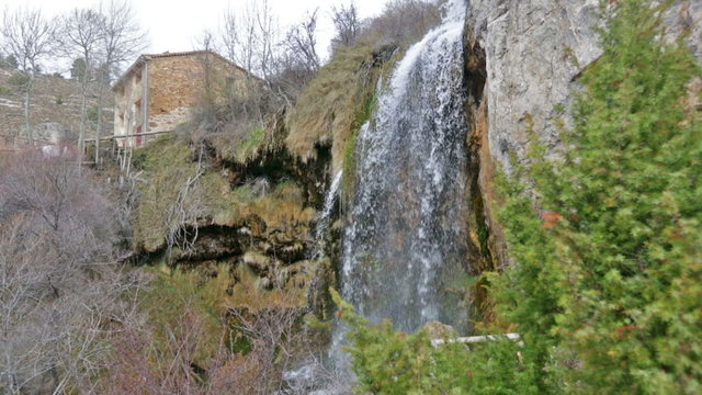 Natural   waterfall at river  in winter. Cuenca, Spain
