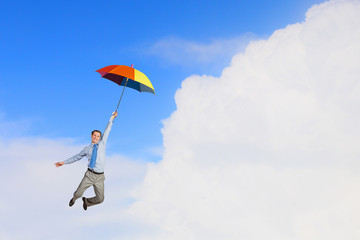Man fly on umbrella