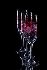 Three glasses with red ornament