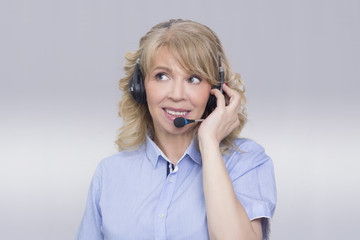 Blonde woman in call center service