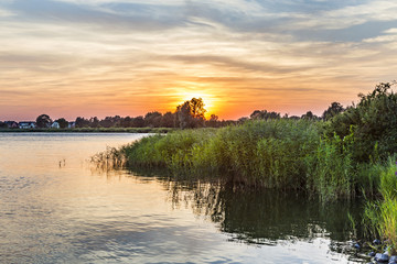 sunset in Zinnowitz with   backwater - obrazy, fototapety, plakaty