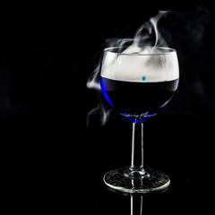 glas with a blue liquid used for chemical analysis..