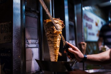 cutting doner meat in a street restaurant in istanbul - 89218779