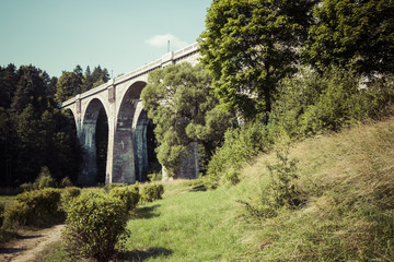 Fototapeta premium Old concrete railway bridge in Stanczyki, Mazury, Poland