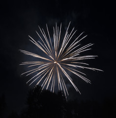 Glowing smoke streaks in fireworks long exposure.   