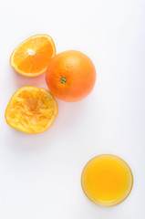 Naklejka na ściany i meble Orange juice with raw citrus segments overhead