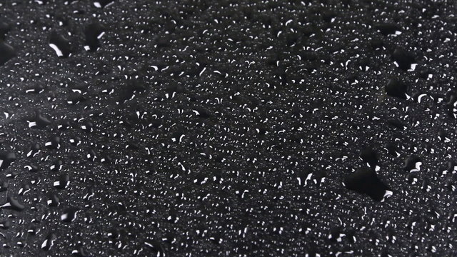 Strong wind is blowing on the water drops, top view