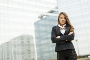 Business woman in front of office building