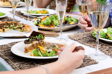 Outdoor lunch party table setting with food