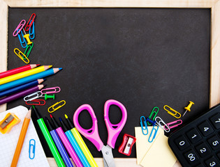 school supplies and blackboard