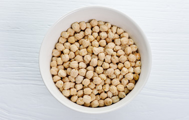 chickpeas isolated on wooden background.