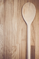 rough wood kitchen tools on a natural wood background