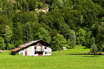 Typical Old Farmhouse - Trentino Italy / Typical old farm house with barn in mountain. Trentino Alto Adige, Italy