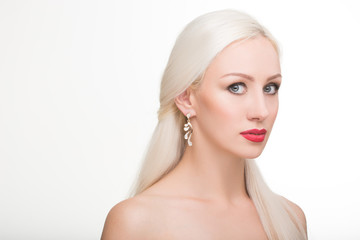 beautiful girl with long white hair and earrings. fashionable