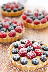 Icing sprinkles on tarts