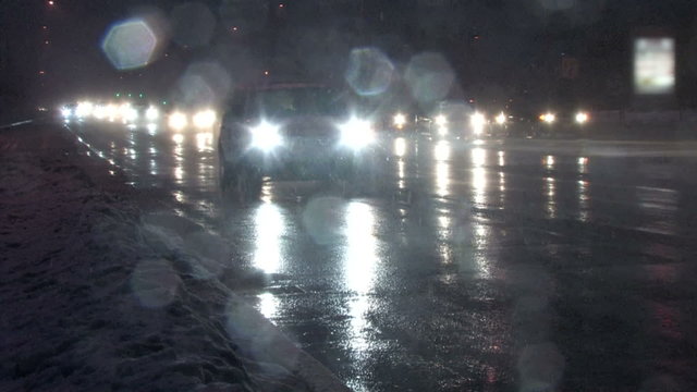 Rush hour traffic coming home at night in a blizzard

