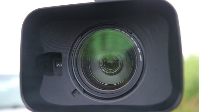 Close up of Digital Video Camera Lens with a Hood 