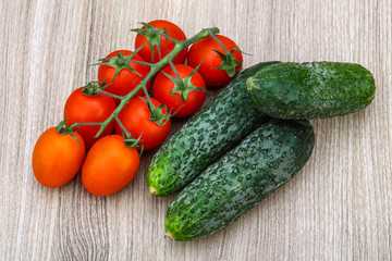 Cucumbers and tomatoes on the branch