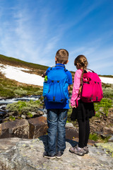 Obraz na płótnie Canvas Kids hiking outdoors in nature
