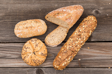 Background of fresh bread and bakery on an old vintage planked w