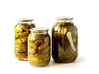 Salted cucumbers in glass jars isolated on white