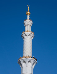 Fototapeta na wymiar minarets against blue sky. Mosque in UAE