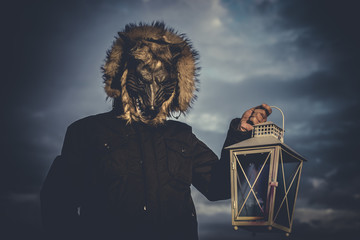 Wolves, man with mask wolf and lamp with colored smoke