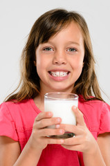 Young kid with glass of milk