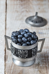 Blueberries in a rustic metal pot