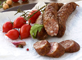 Smoked sausage with greens and tomatoes