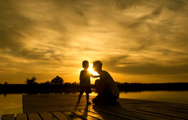 Family sunset on the lake