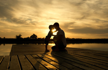 Family sunset on the lake