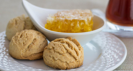Traditional round shortbread biscuits with honey