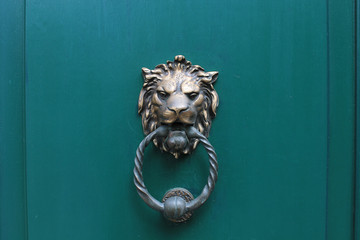 Lion head door knocker in Bruges, Belgium