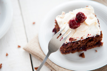 Piece of cherry and meringue cake